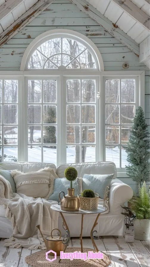 A sunroom that has large windows, allowing natural light in.