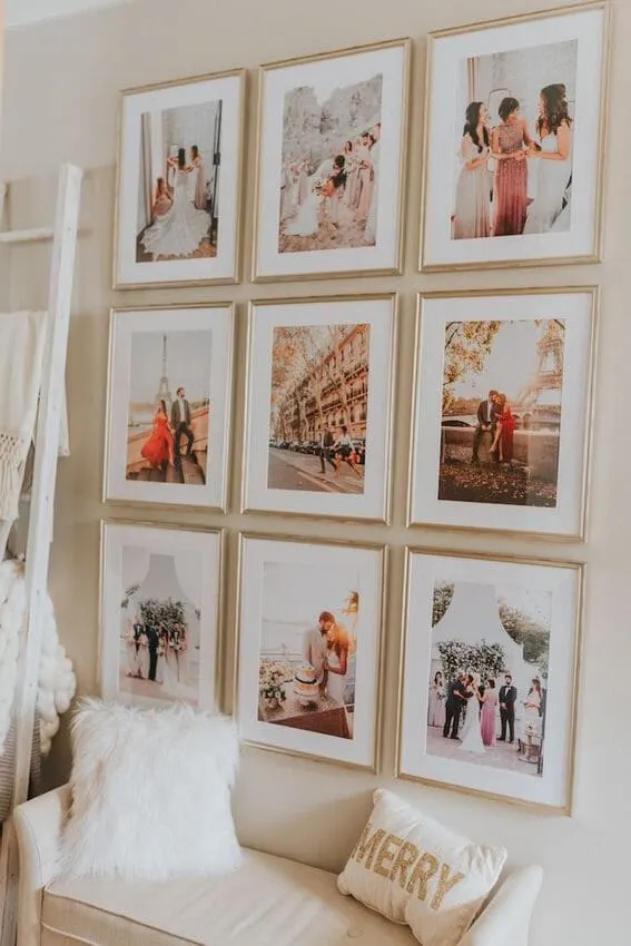 Elegant wedding photo gallery wall in living space