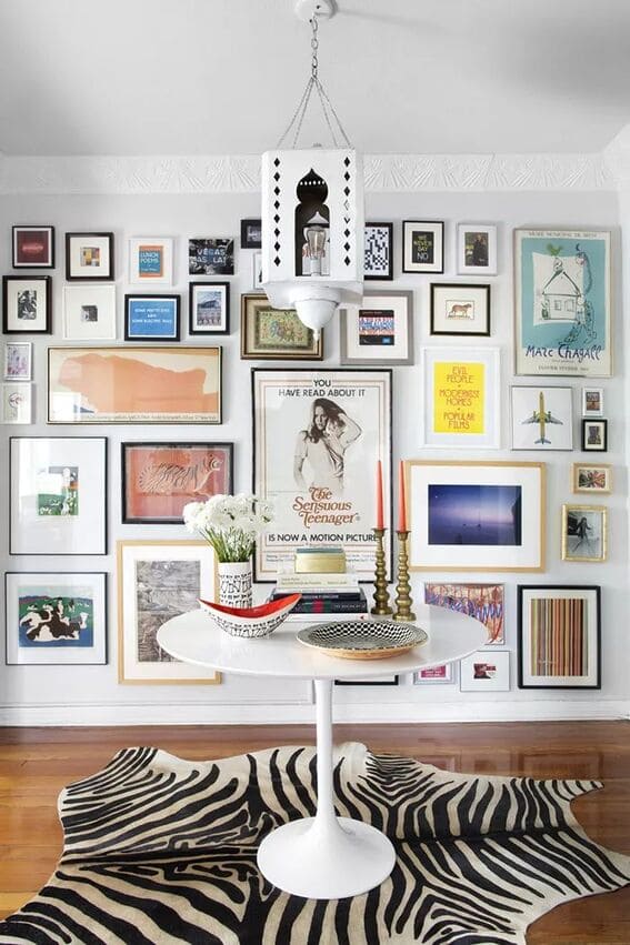 Vibrant living room gallery wall with diverse artwork