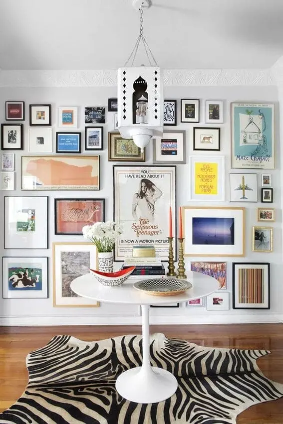 Vibrant living room gallery wall with diverse artwork