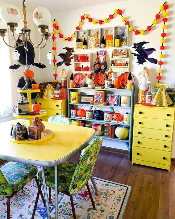 Retro-inspired dining room filled with vibrant Halloween decor. 