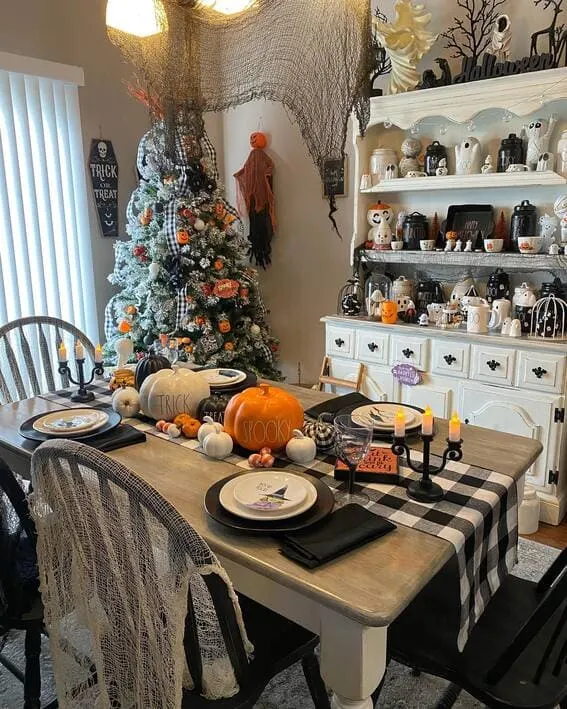 Cozy farmhouse dining room with Halloween-themed decor. 