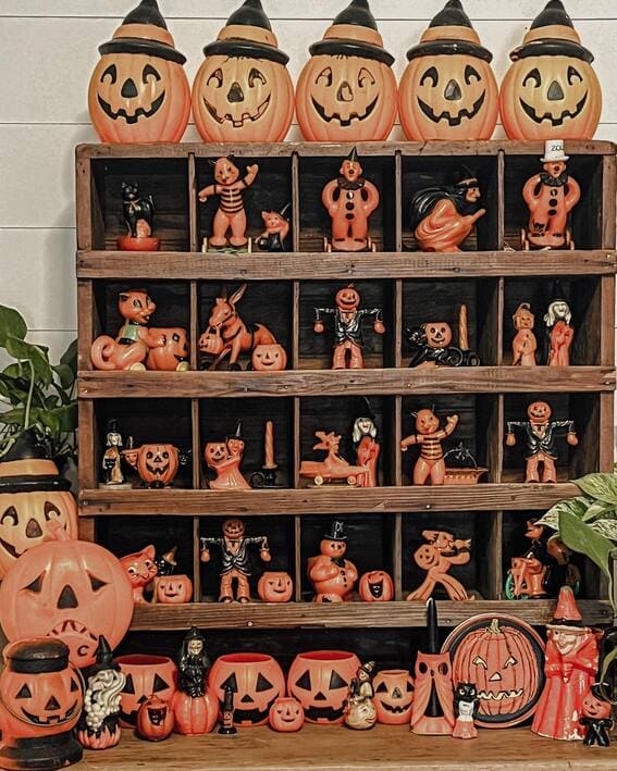 Dining room console table filled with vintage Halloween decor. 