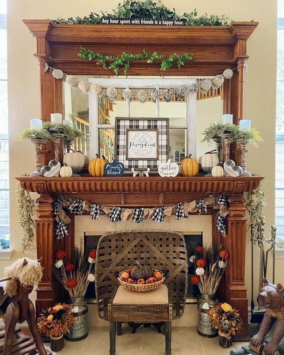 Rustic fall mantel with gingham accents, pumpkins, and natural greenery. 