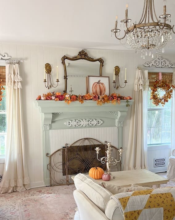 Fall mantel decor features pumpkins, garland, and vintage touches for an eye-catching autumn display. 