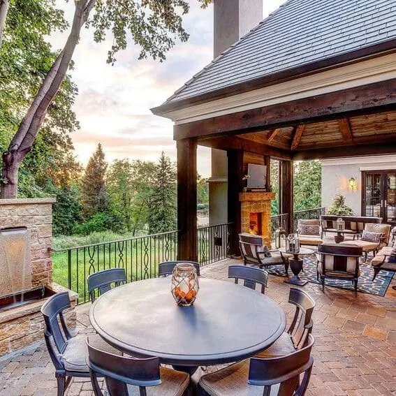 Beautiful patio that has an enclosed deck that has an outdoor fireplace and breathtaking views. 