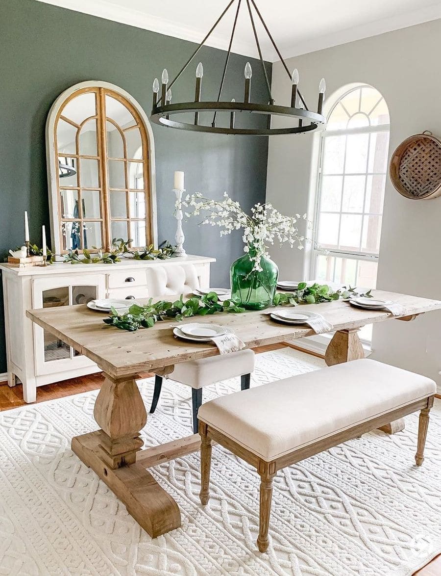 This image is an inspo for a farmhouse dining setup with a bold, rustic wood dining table that anchors the room with warmth and style.Farmhouse dining room decor inspiration by @rusticpigdesigns / Instagram