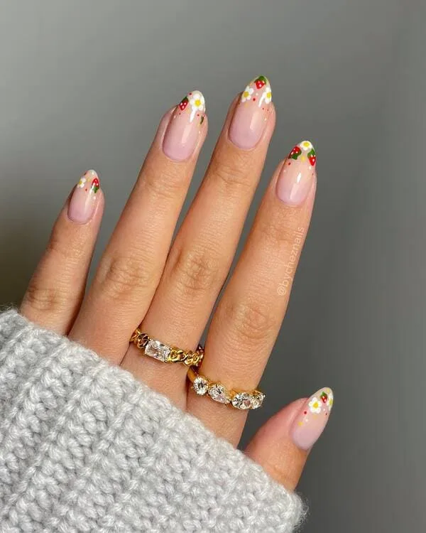 spring nails with strawberries and flowers on pink base