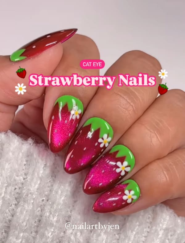 spring nails with red cat-eye effect and green strawberry tips