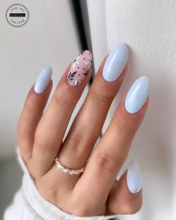 pastel blue spring nails with black leaf design