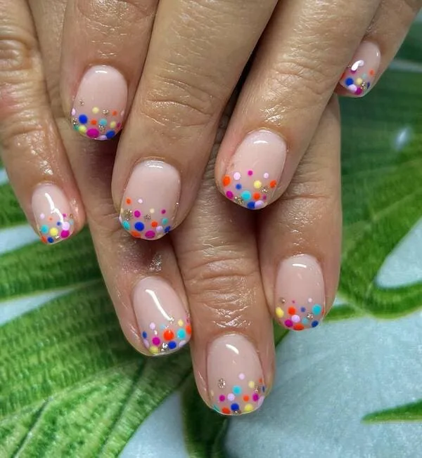 spring nails with colorful confetti on the tips